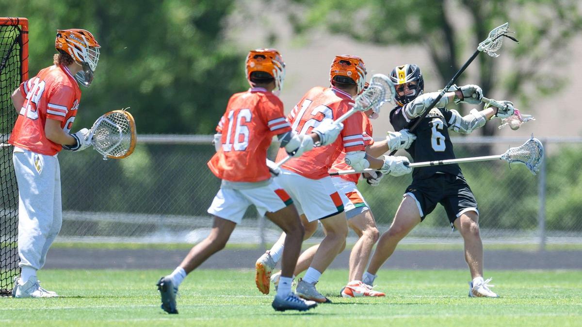 Woodford County’s Grey Hodge (6) looks to pass during the Yellowjacket’s 16-6 win over Frederick Douglass in the 2025 KHSAA Boys’ Lacrosse State Tournament quarterfinals, Saturday.