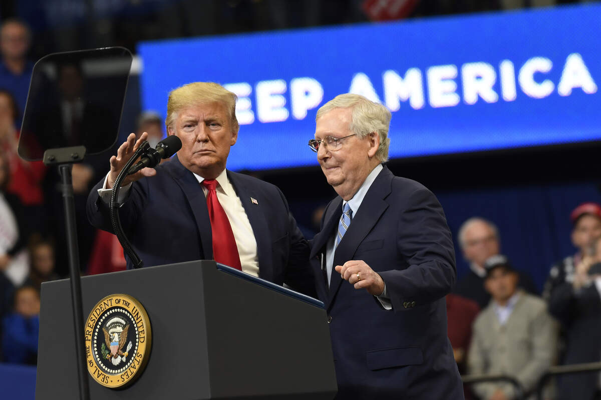 President Donald Trump brings Senate Majority Leader Mitch McConnell of Ky., on stage during a campaign rally in Lexington, Ky., Monday, Nov. 4, 2019. (AP Photo/Susan Walsh)