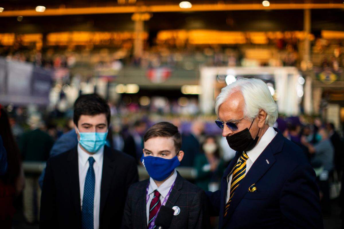 Trainer Bob Baffert and his sons speak with reporters after his horse, Authentic, won the 2020 Breeders’ Cup Classic at Keeneland during the COVID-19 pandemic.