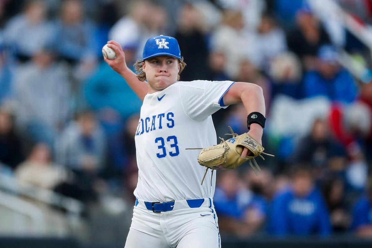 Kentucky pitcher Travis Smith (33) throws a Louisville runner out at first base during Tuesday night’s game at Kentucky Proud Park. Smith, UK’s starter, allowed one run in five innings.