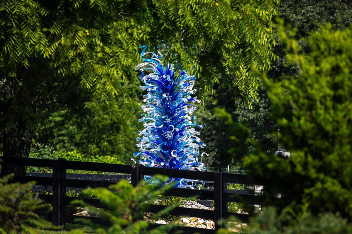“Sapphire and Platinum Waterdrop Tower” by Dale Chihuly is displayed at Maker’s Mark new Chihuly exhibition at Star Hill Farm, home of Maker’s Mark Distillery, in Loretto, Ky., on Friday, July 18, 2025.