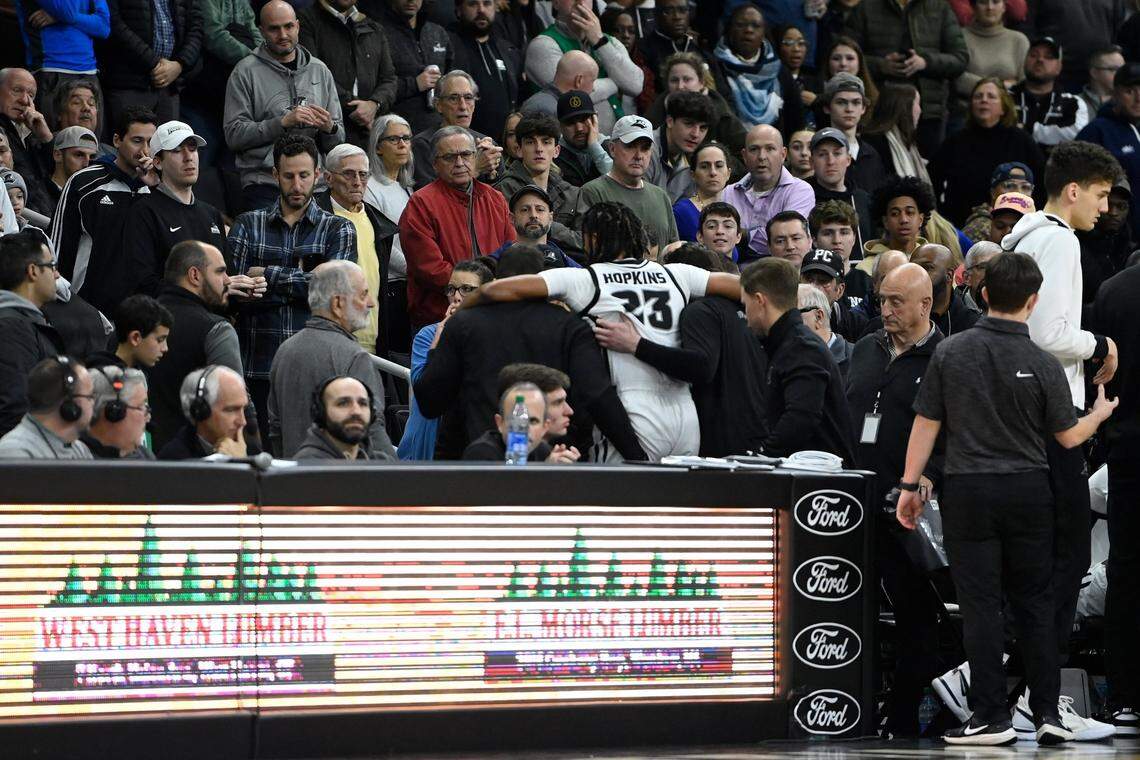 Jan 3, 2024; Providence, Rhode Island, USA; Providence Friars forward Bryce Hopkins (23) is helped to the locker room during the second half against the Seton Hall Pirates at Amica Mutual Pavilion. Mandatory Credit: Eric Canha-USA TODAY Sports
