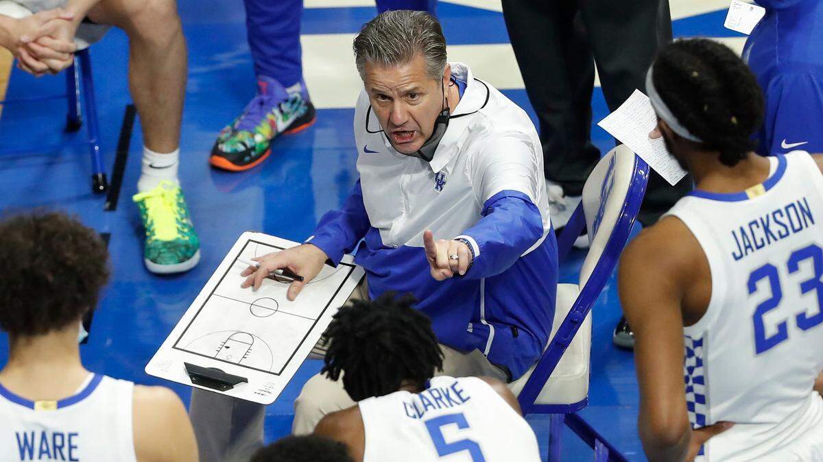 Kentucky Wildcats head coach John Calipari speaks with players during their game against the Notre Dame Fighting Irish at Rupp Arena in Lexington, Ky., Saturday, Dec. 12, 2020.
