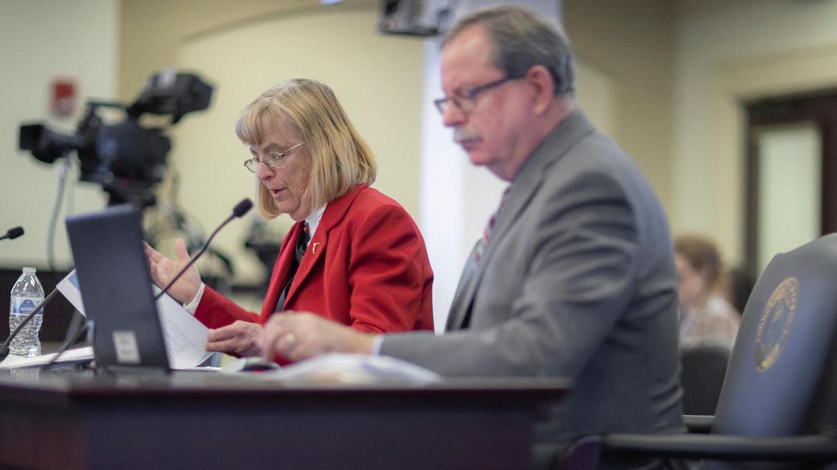 Vicki Reed, left, Kentucky Department of Juvenile Justice commissioner, and John Hicks, executive cabinet secretary and state budget director, present at a subcommittee meeting at the Kentucky state Capitol annex in Frankfort, Ky., on Tuesday, Feb. 14, 2023.