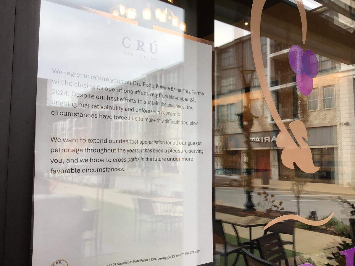A sign on the door of CRU, a restaurant and wine bar at Summit at Fritz Farm in Lexington, announces the business is closed as of Nov. 24, 2024.