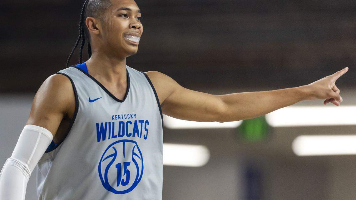Kentucky basketball guard Jaland Lowe (15) points to a teammate during UK’s annual Blue-White Game on Friday, Oct. 17, 2025, at Memorial Coliseum in Lexington, Ky. Lowe injured his right shoulder during the game and hasn’t played for the Wildcats since. 