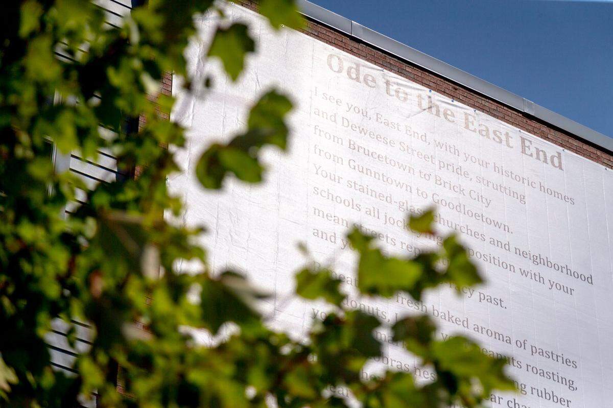 The banner with a poem by Frank X Walker, “Ode to the East End,” is the first of several pieces of art that were commissioned by Community Ventures Corp. for The MET.