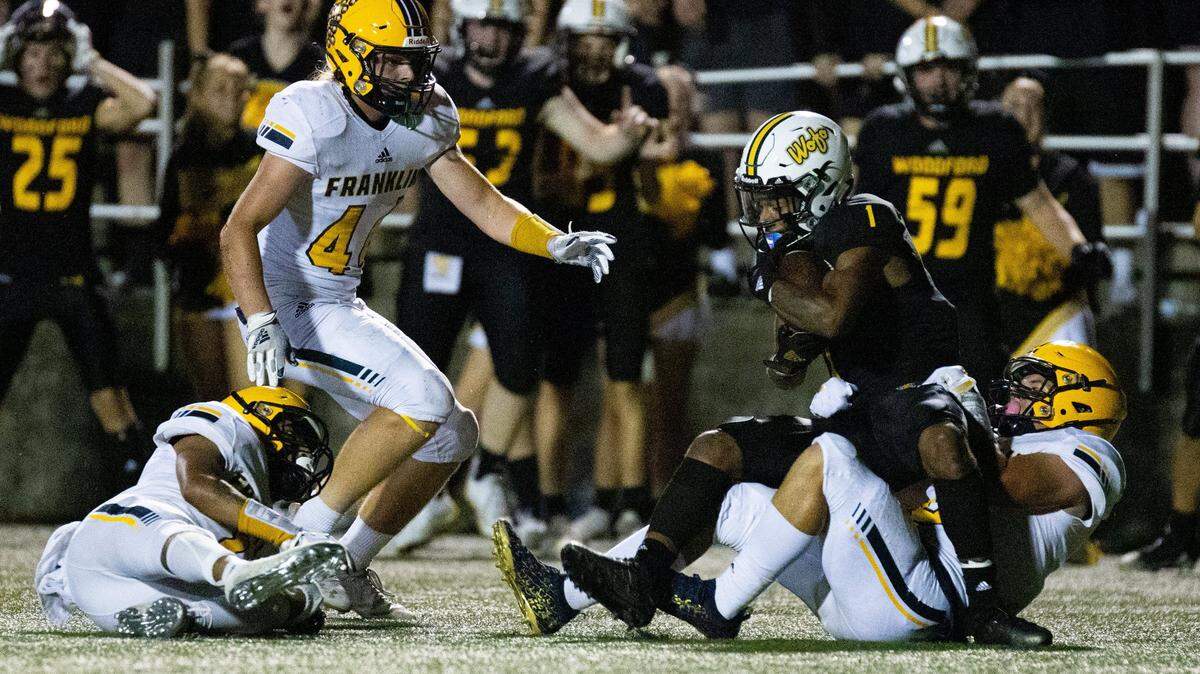 Woodford County’s Jacob Jackson (1) gets tackled during the Franklin County vs. Woodford County high school football game on Friday, Sept. 17, 2021, in Versailles, Kentucky. Woodford County won 24-21.