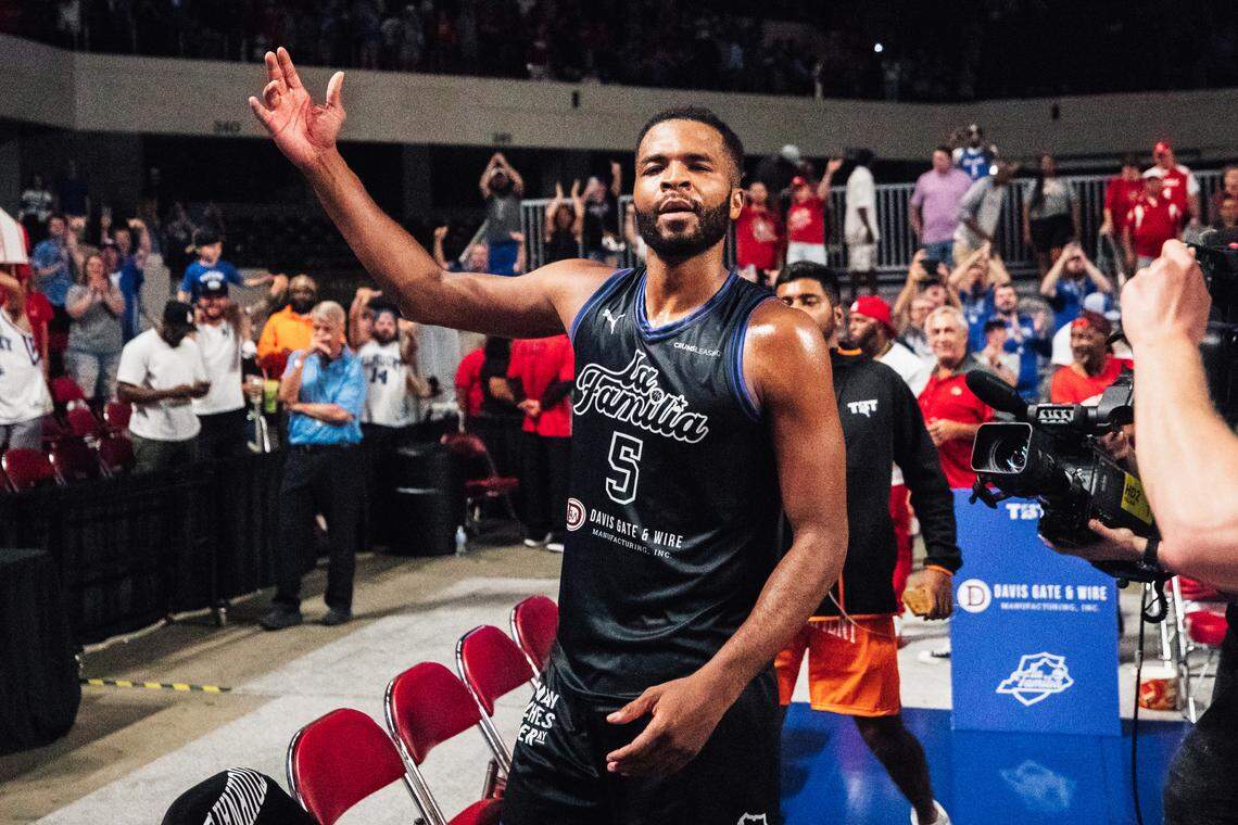 Andrew Harrison celebrates La Familia’s victory over The Ville in the TBT quarterfinals in Freedom Hall on Monday night.