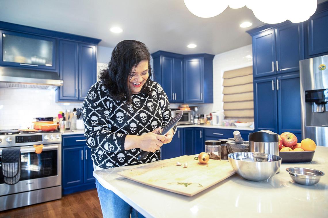 Samantha Fore prepares a mango curry at her home. Fore may be the most famous chef in Lexington who doesn’t have a restaurant.