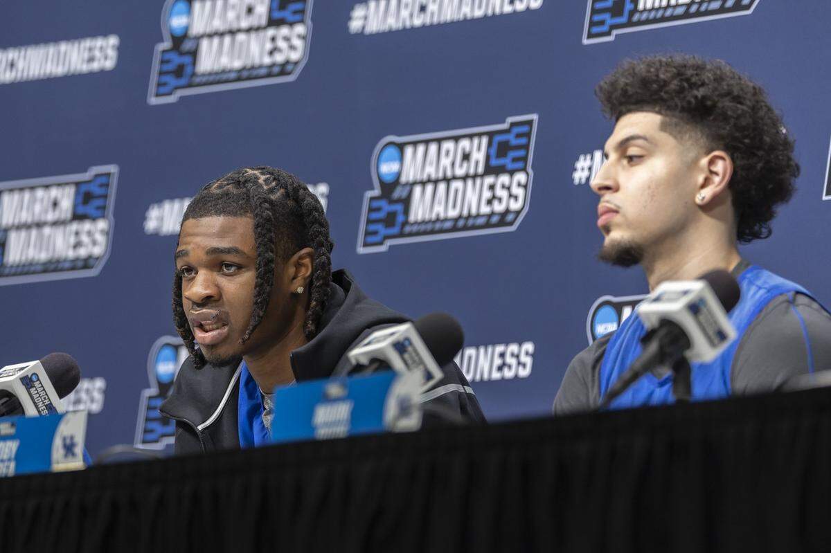 Kentucky’s Otega Oweh, left, speaks during a press conference at Fiserv Forum in Milwaukee last week. UK basketball coach Mark Pope has had players begin postgame press conferences this season with opening statements, which are normally done by the coach.