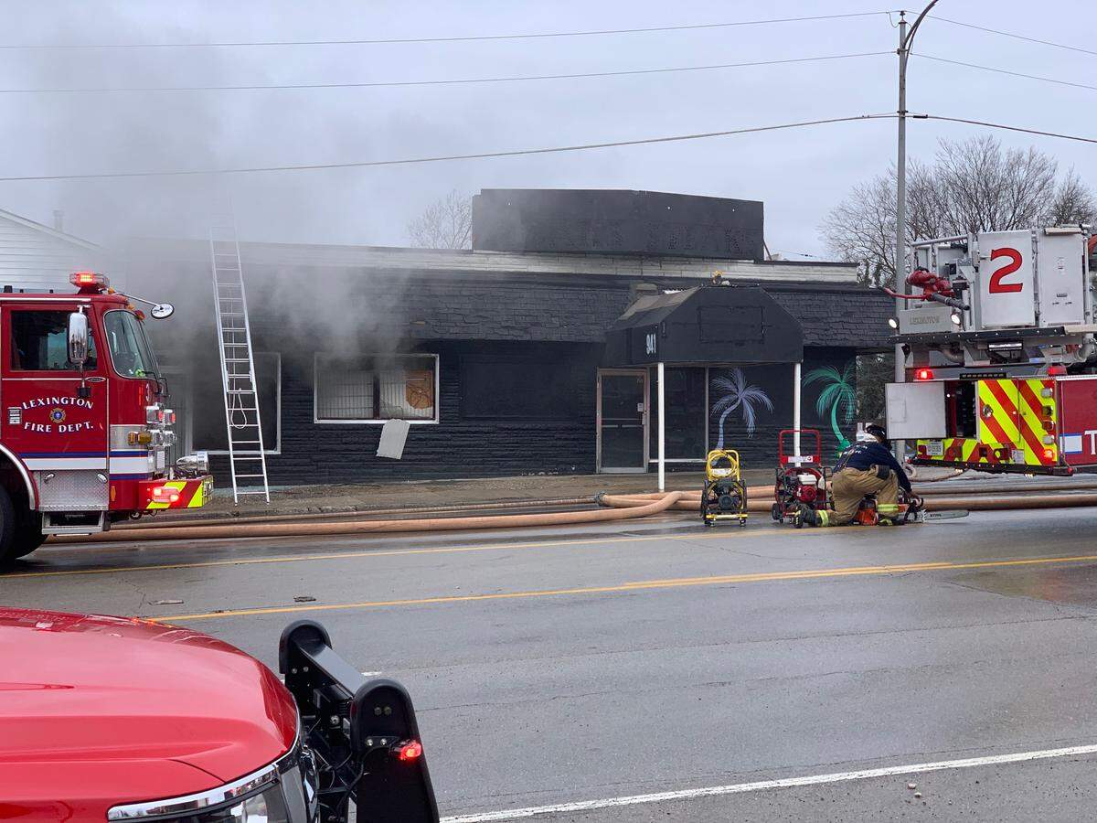 Smoke flowed out of a building in the 900 block of Winchester Road in Lexington Friday.