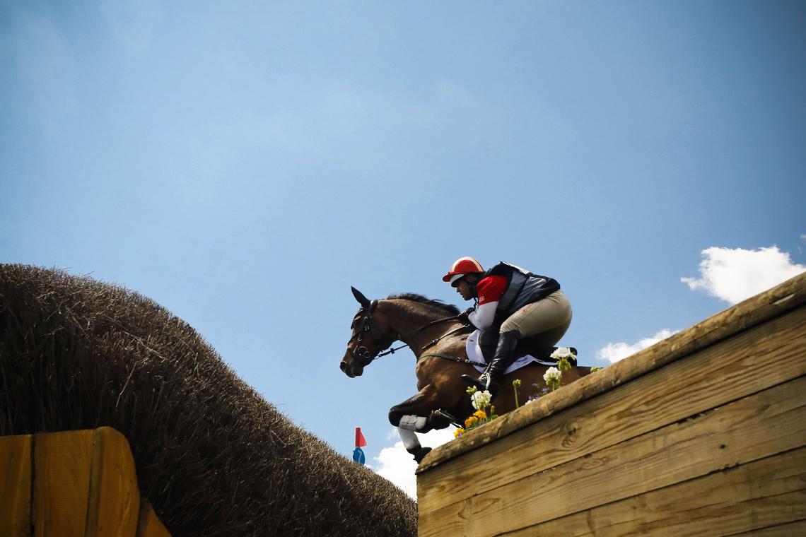 Buck Davidson and Carlevo cleared the fence at Keepers Brush during the Land Rover Kentucky Three-Day Event Cross-Country competition Saturday at the Kentucky Horse Park. He is in 20th place on this horse, in 13th place on Copper Beach, and in 31 place on Park Trader.