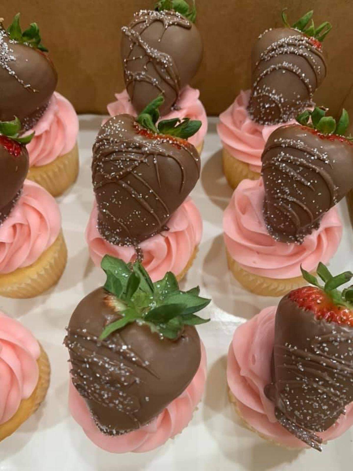Cupcakes with chocolate covered strawberries on top from Poppy’s Bakery in Frankfort.