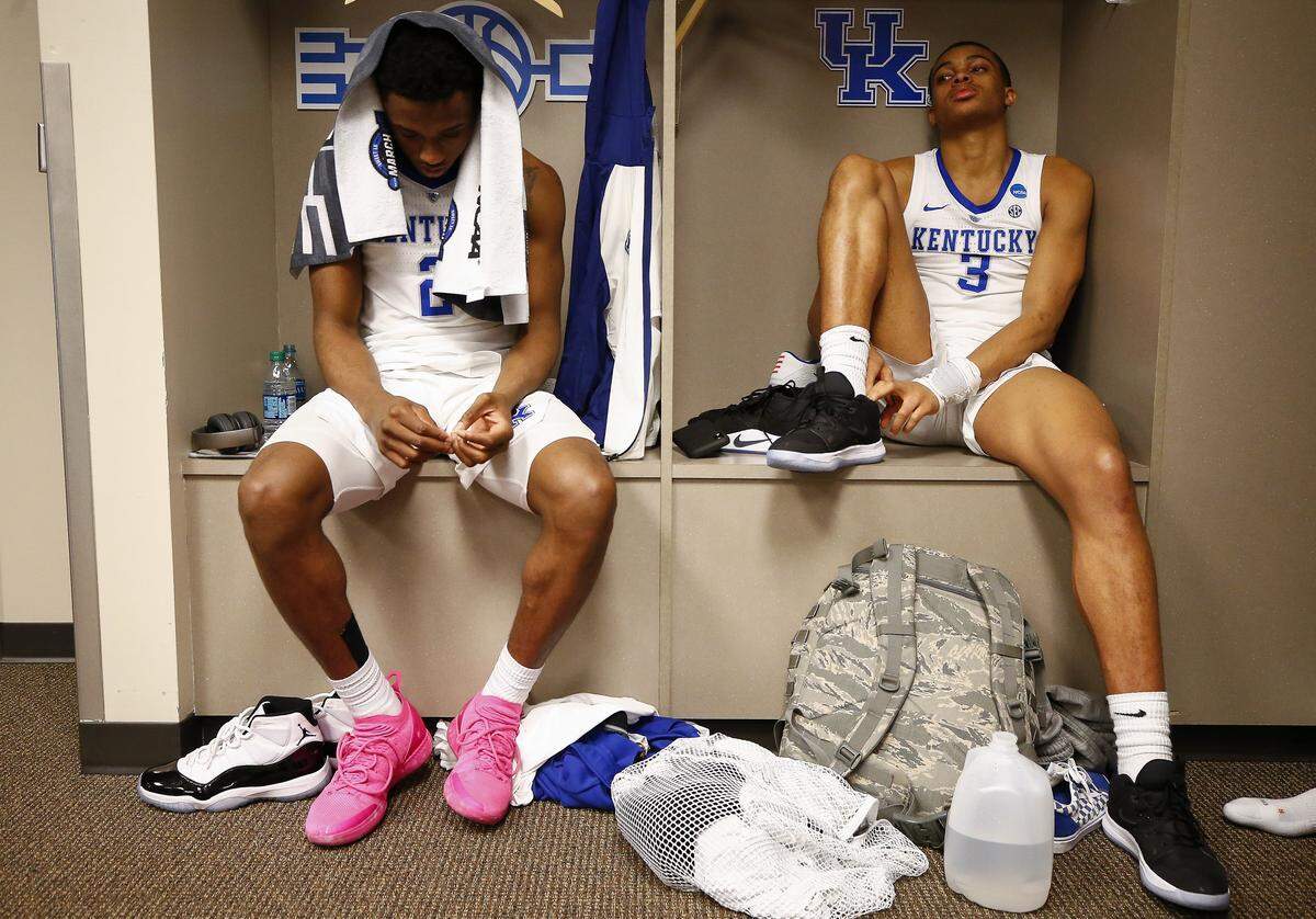 In a dejected Kentucky locker room, UK freshmen Ashton Hagans, left, and Keldon Johnson reflected on the Cats’ season-ending 77-71 loss to Auburn.