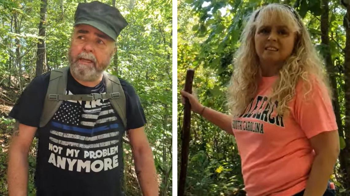 Fred McCoy, left, and his wife, Shelia, as the couple looks for Joseph Couch in the forest near London, Ky. off Interstate 75 where he Couch fired on 12 vehicles Sept. 7, 2024.