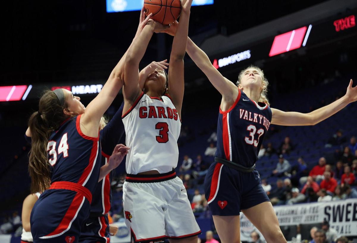 Sacred Heart’s Alex Wolff (34) and Josie Gilvin (33) pressure Clark County’s Ciara Byars (3) during Friday night’s Sweet 16 quarterfinal game in Rupp Arena.