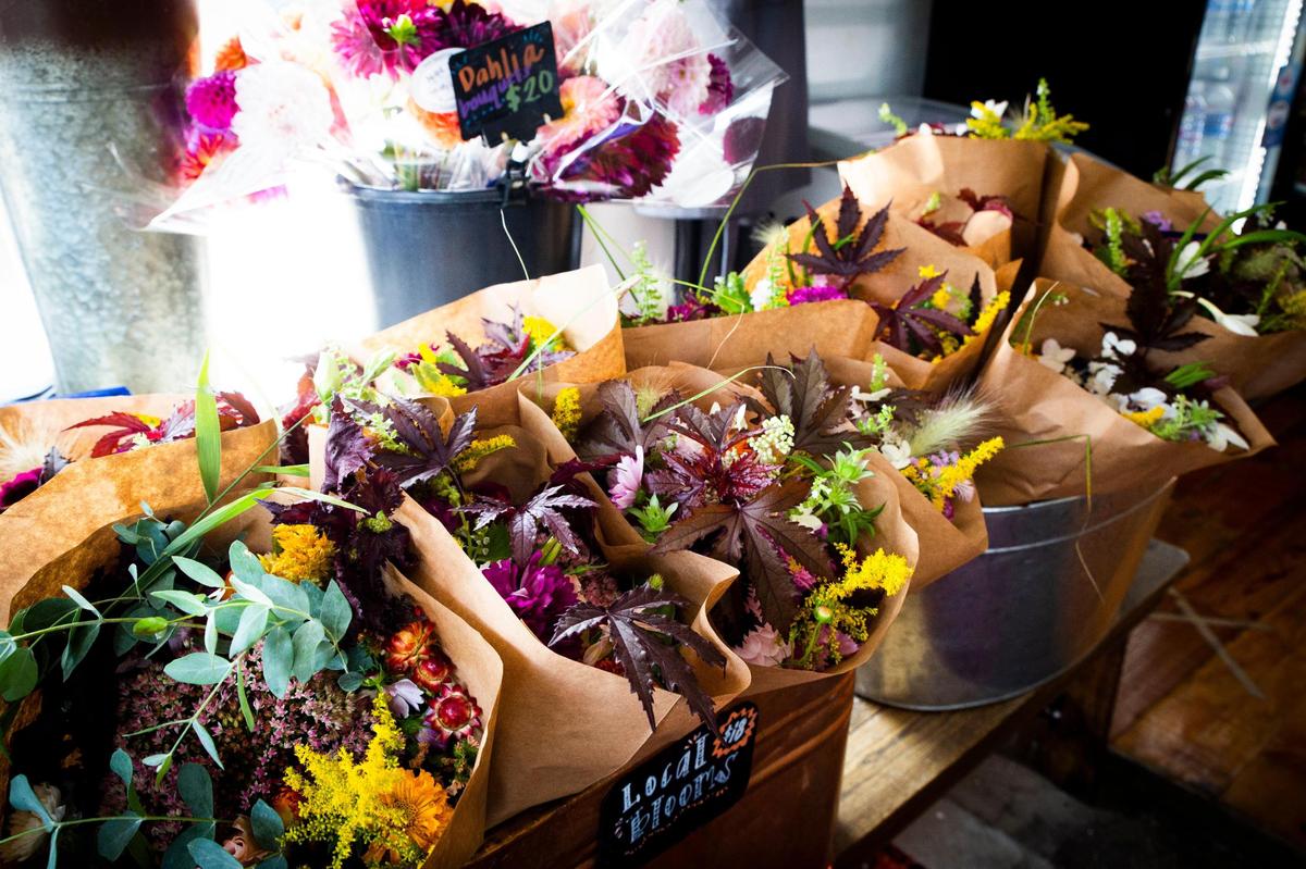 Fresh local flowers, available every Friday, sit by the entrance Sept. 20 at Wilson’s Grocery, located on Cramer Avenue.