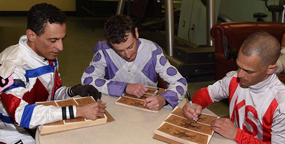 Jockeys John Velazquez, Julien Leparoux and Javier Castellano signed labels, along with Robby Albarado, Mike Smith, Rob Samuels and Bill Thomason, that were then placed on the commemorative bottles.