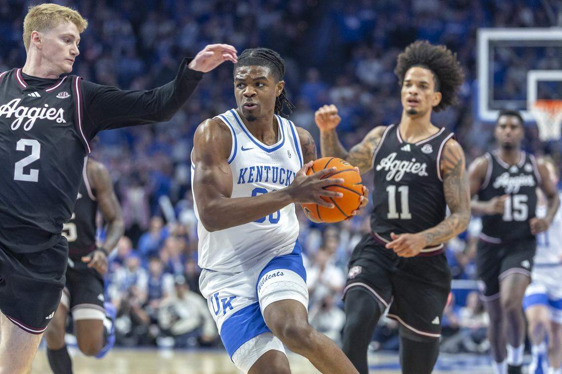 Kentucky guard Otega Oweh (00) drives the ball as Texas A&M guard Hayden Hefner (2) defends during a game at Rupp Arena in Lexington, Ky., on Tuesday, Jan. 14, 2025.