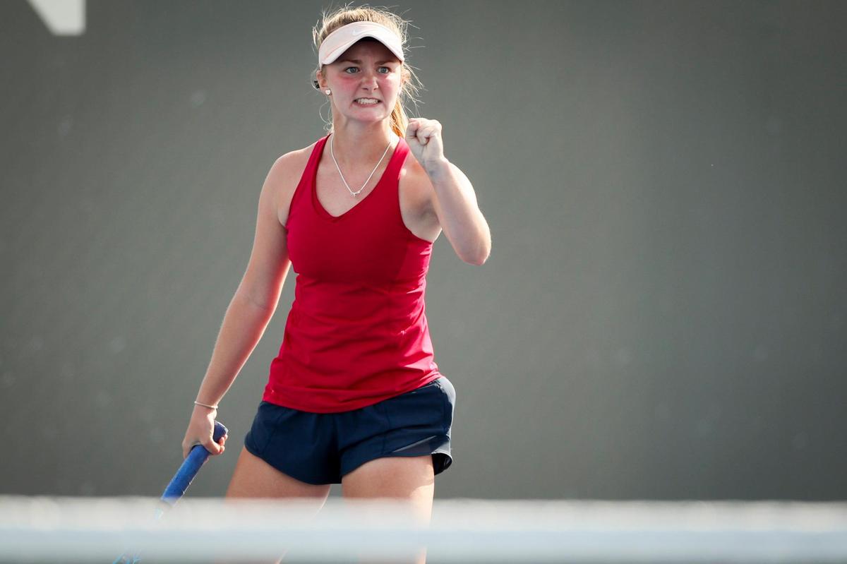 Scott County’s Olivia Gallagher celebrated during her girls’ singles match against Lexington Catholic’s Jaycie Mair during the 11th Region Tennis Tournament at Top Seed Tennis Club in Nicholasville.