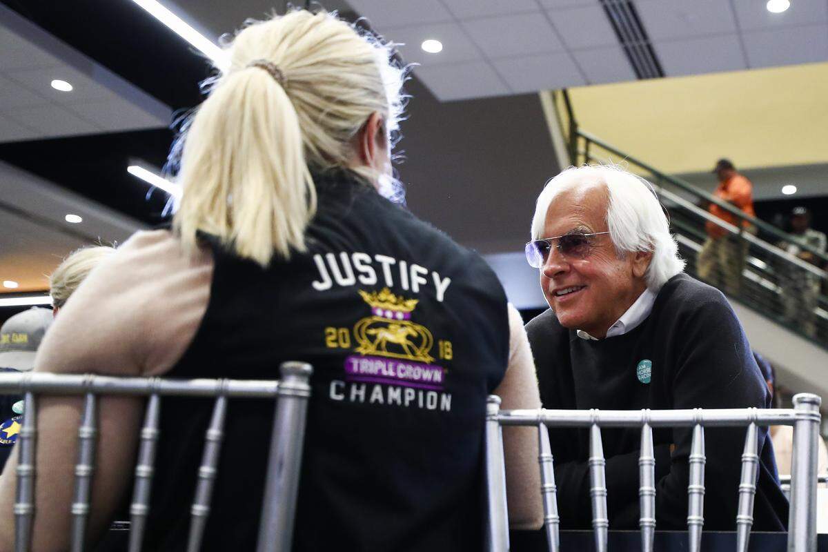 Trainer Bob Baffert spoke with his wife, Jill, during the post-position draw for the Kentucky Derby on Tuesday. Baffert will go for his record-tying sixth Derby win on Saturday.
