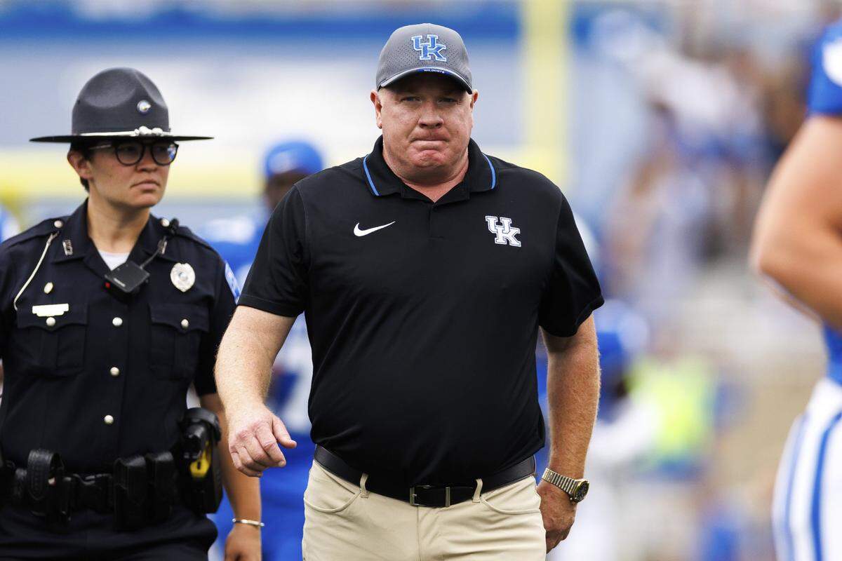 Sep 21, 2024; Lexington, Kentucky, USA; Kentucky Wildcats head coach Mark Stoops walks onto the field before the game against the Ohio Bobcats at Kroger Field. Mandatory Credit: Jordan Prather-Imagn Images