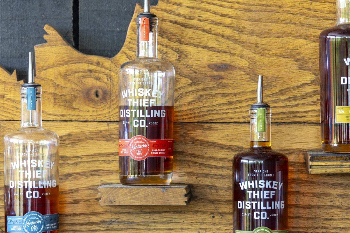 Whiskeys distilled on their 127-acre farm are displayed at Whiskey Thief Distilling Co. in Frankfort, Ky., on Thursday, May 7, 2026.