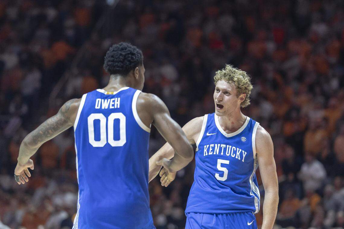 Kentucky basketball players Otega Oweh, left, and Collin Chandler celebrate during a game against Tennessee on Saturday, Jan. 17, 2026, at Thompson-Boling Arena in Knoxville, Tenn.