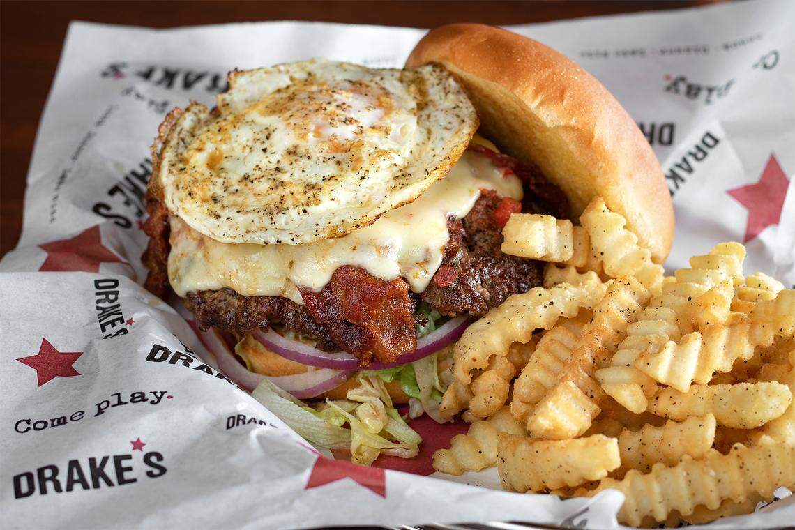 Drake’s Morning Glory Burger with Pepper Jack cheese, bacon, fried egg and fire-roasted salsa.