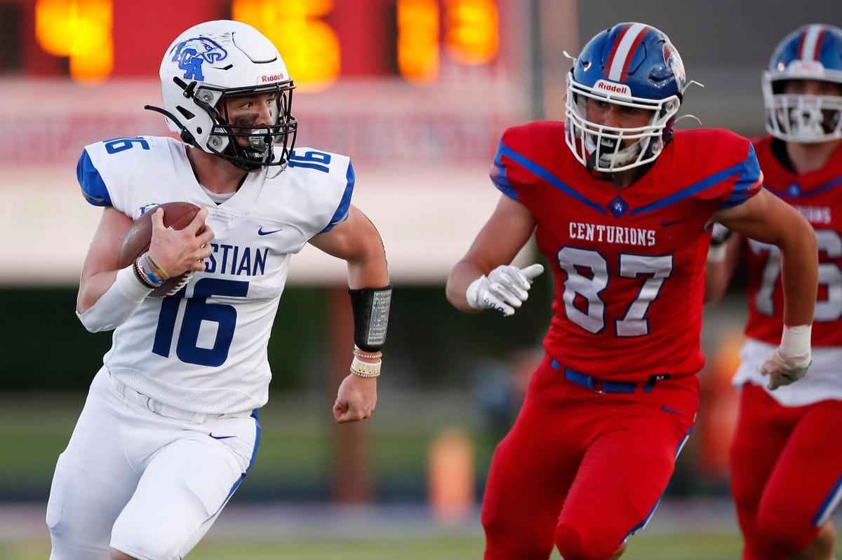 Lexington Christian’s Mason Moore (16) runs the ball past Christian Academy-Louisville’s Ian McKinley (87) during a game at Christian Academy-Louisville in Louisville, Ky., Friday, Sept. 10, 2021. Lexington Christian beat Christian Academy-Louisville 37-14.