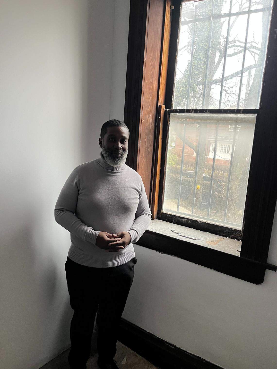 The Rev. Henry Walter, pastor of Historic St. Paul AME Church, in the tiny hidden room believed to be a station on the Underground Railroad in Lexington.