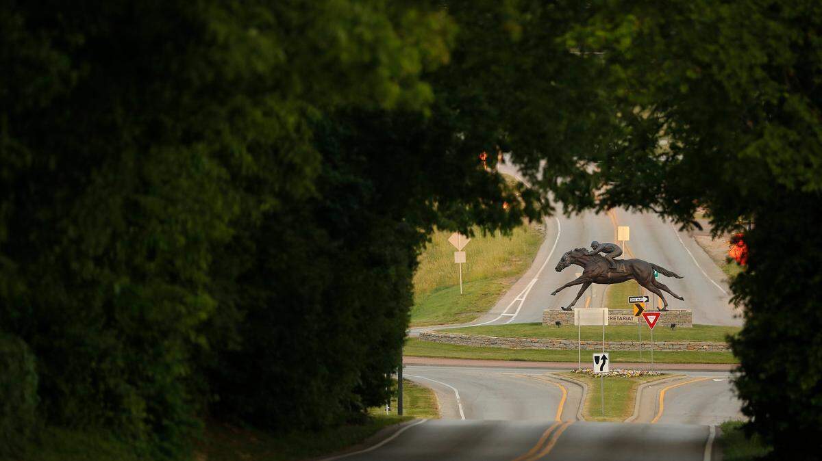 A statue of Secretariat by sculptor Jocelyn Russell sits in a roundabout where Old Frankfort Pikes meets Alexandria Drive in Lexington, Ky., Tuesday, May 25, 2021. Old Frankfort Pike was selected as one of this years 34 National Scenic Byways by the Federal Highway Administration.