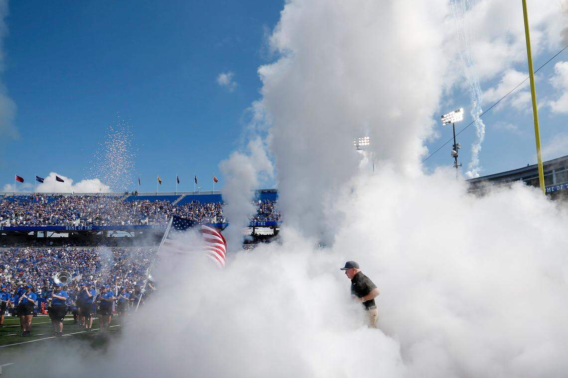 Kentucky head coach Mark Stoops takes the field with his team before facing Ball State at Kroger Field on Sept. 2.