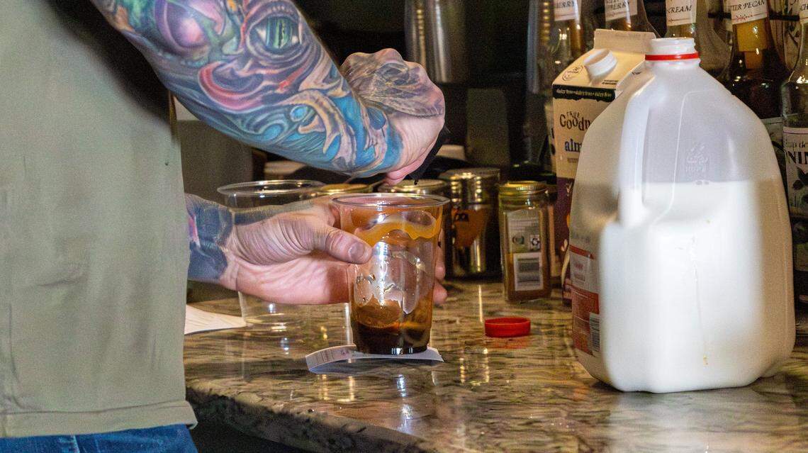 Owner of Brewtanicals Coffee House & Plant Lounge, Stephen Greasor, prepares a caffè mocha at Brewtanicals Coffee House & Plant Lounge on March 25, 2026, in Richmond, Ky.