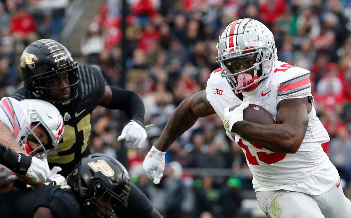 Ohio State Buckeyes running back Chip Trayanum (19) rushes the ball during the NCAA football game against the Purdue Boilermakers, Saturday, Oct. 14, 2023, at Ross-Ade Stadium in West Lafayette, Ind. Ohio State Buckeyes won 41-7.