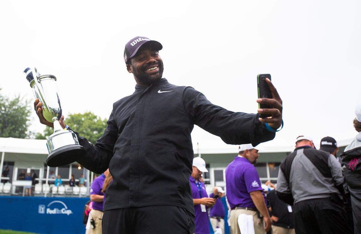 Wayne Birch, caddie for tournament winner Troy Merritt, took a video with the trophy after Merritt won the PGA Tour Barbasol Championship in 2018. Merritt is returning for this year's tournament at Champions at Keene Trace Golf Club in Nicholasville next week.