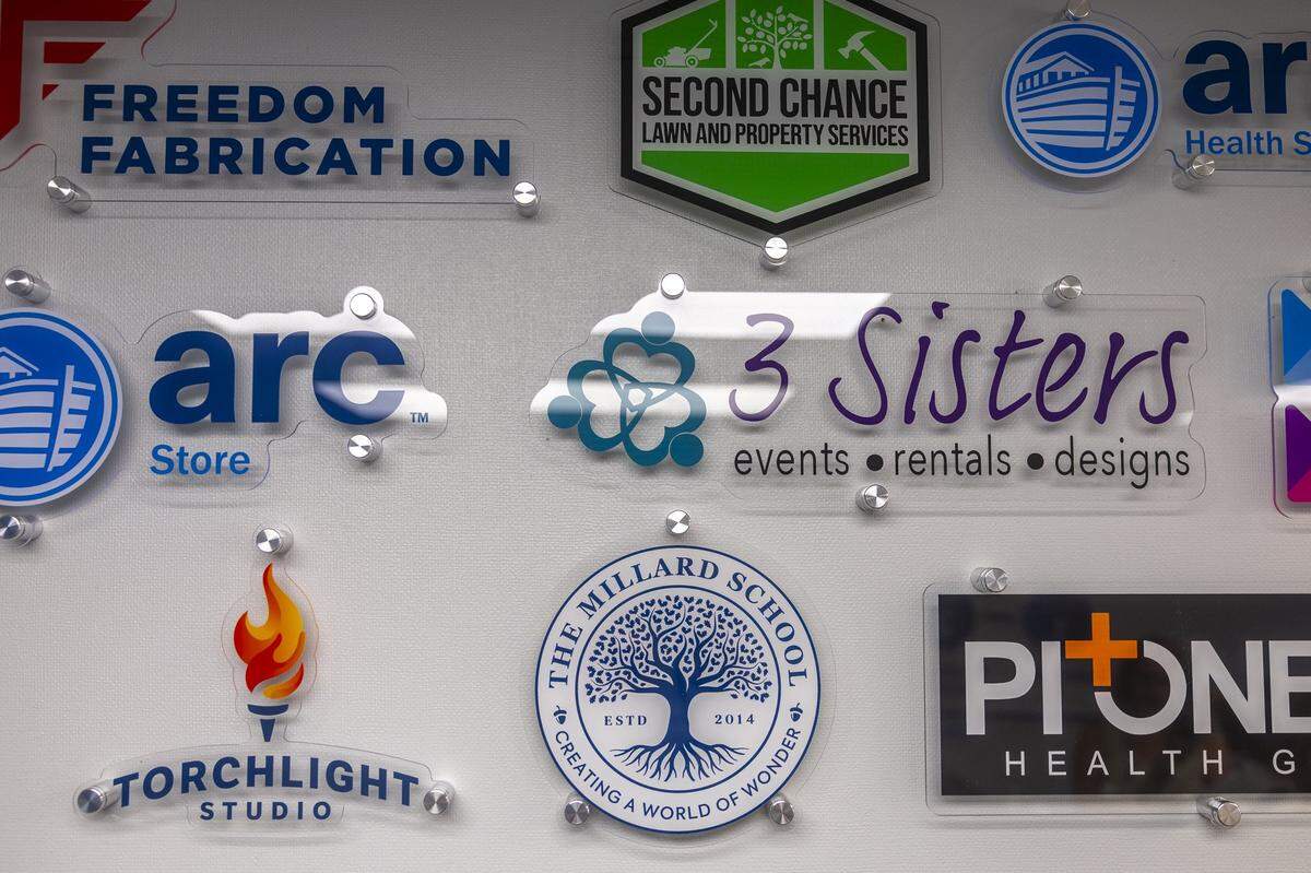 Logos of organizations under the Addiction Recovery Care umbrella are on display at ARC’s career services office in Louisa, Ky., on Thursday, July 11, 2024.