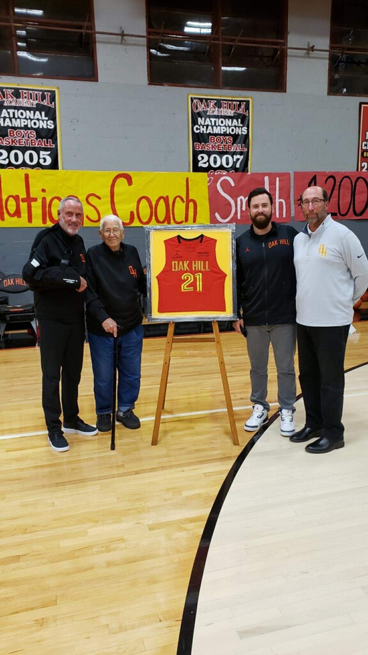Steve Smith, left, was recognized on Oct. 29, 2021, after winning his 1,200th career game. Pictured with Smith were, left to right, Steve’s father, Winston Smith; his son, Sean Smith; and his brother, Stu Smith.