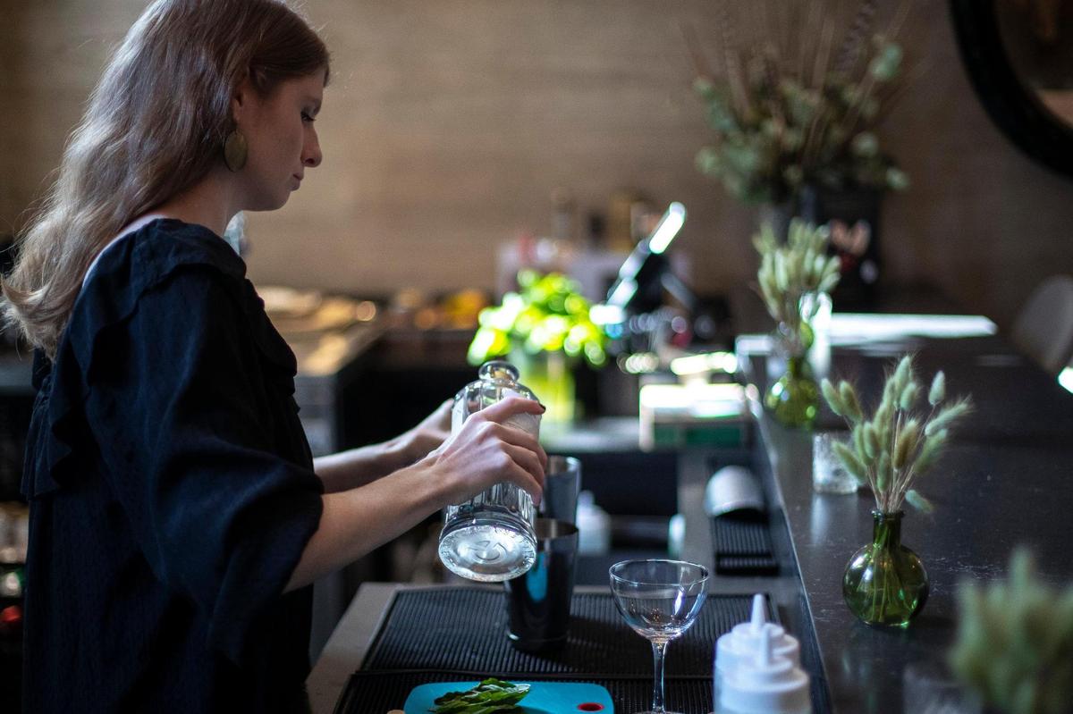Isabelle Hay, Limewater co-owner, makes the bar and bistro’s signature drink, the Limewater, at the restaurant at 900 Wilkinson Blvd. in Frankfort, Ky., on Wednesday, Sept. 28, 2022.