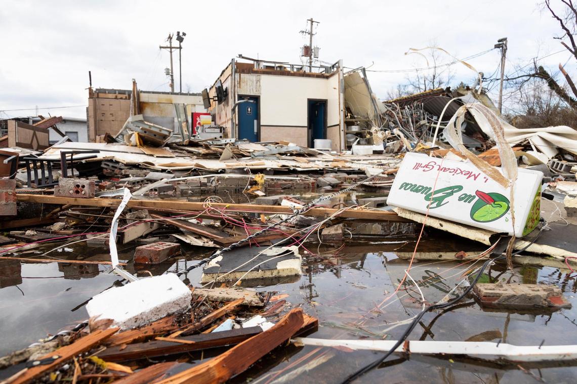Debris and rubble of the building that used to house Que Buenos Mexican Grill on the 31W By-Pass road after a tornado came through the area in Bowling Green, Ky., Saturday, December 11, 2021. The 31W By-Pass was an area hit the hardest by a tornado that passed through Friday night.