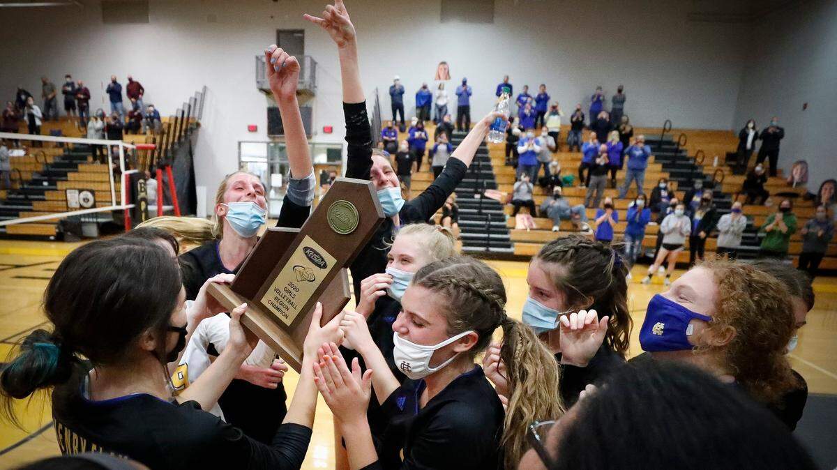 Henry Clay celebrated with the trophy after the 11th Region volleyball championship game against Tates Creek at Berea Community High School last October. This year, there are a number of challengers for the crown.