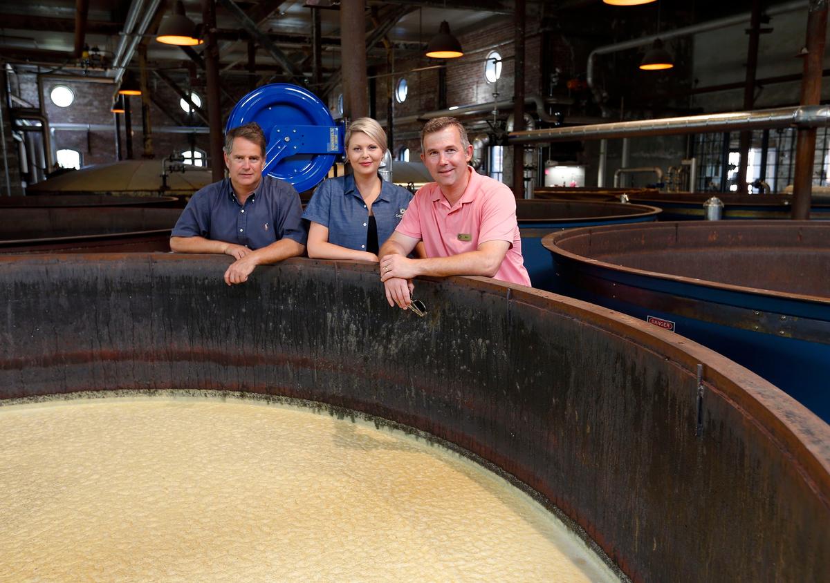 Co-owners Will Arvin, Marianne Eaves and Wes Murry photographed in 2018 after they brought a defunct distillery back to life. The fermenting tanks at Castle & Key again hold mash that will become gin, vodka, rye whiskey and bourbon. The distillery reopened in 2018 after four years of renovation to the derelic former Old Taylor Distillery.