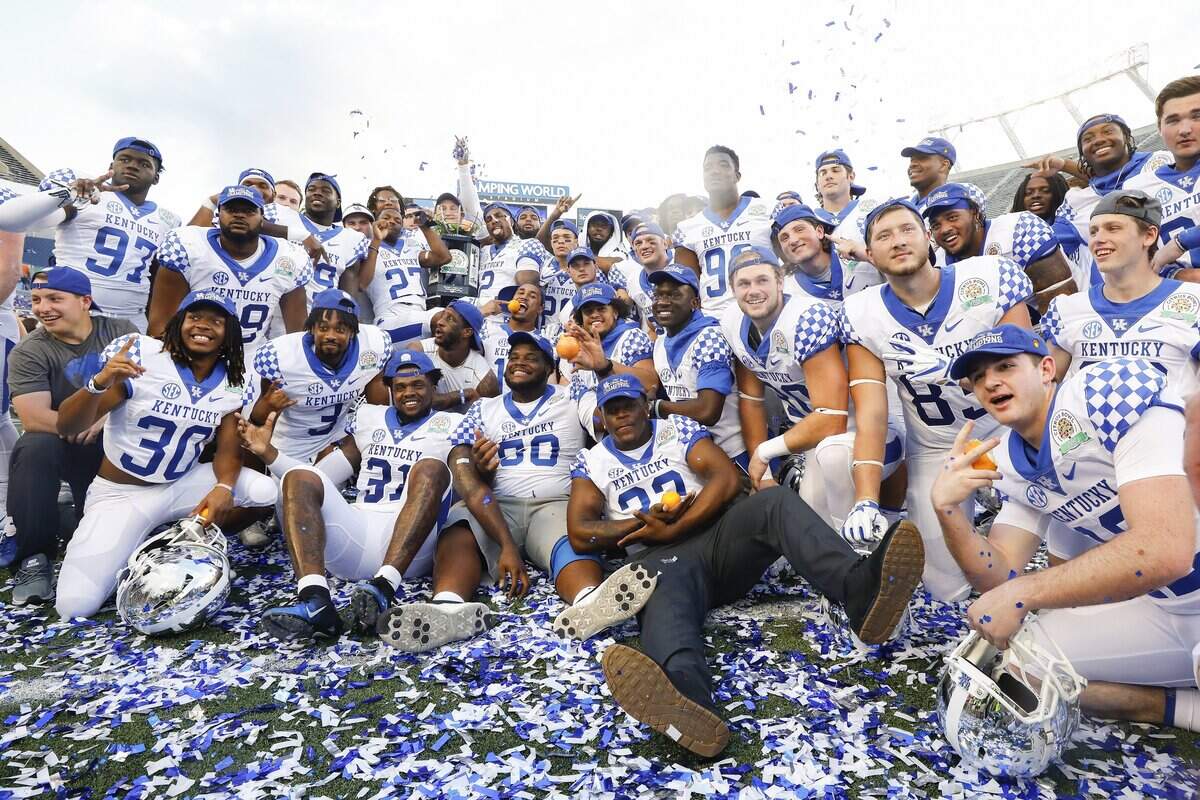 Kentucky players celebrated after winning the VRBO Citrus Bowl 27-24 over Penn State. UK finished the season ranked No. 12 in the Associated Press poll and No. 11 in the coaches’ poll.