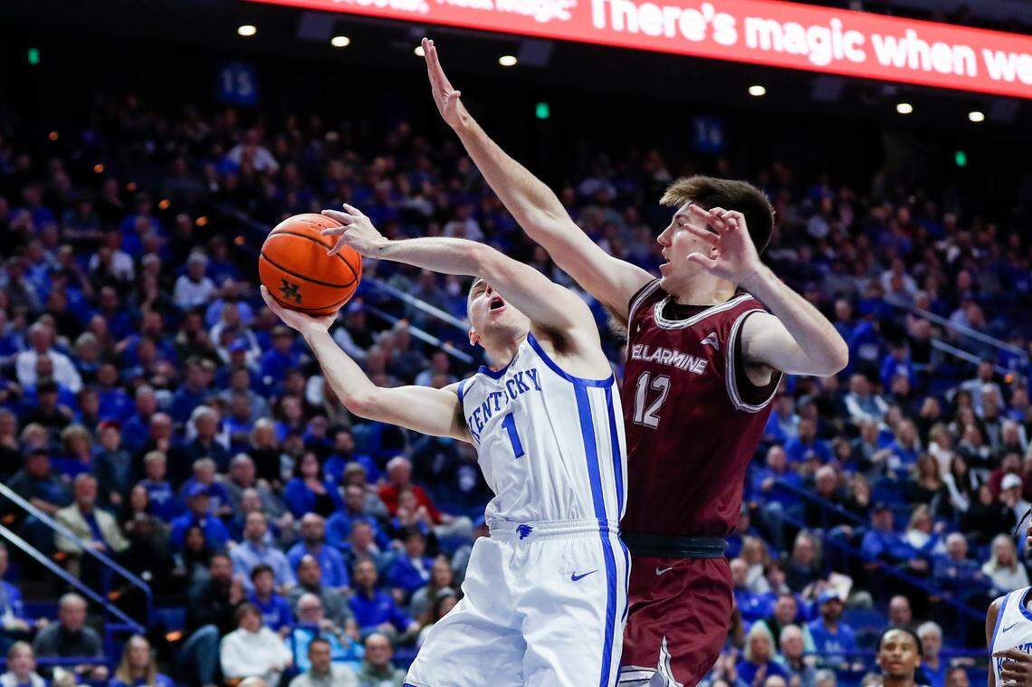 Kentucky’s CJ Fredrick (1) shoots the ball while guarded by Bellarmine’s Langdon Hatton during Tuesday’s game at Rupp Arena.