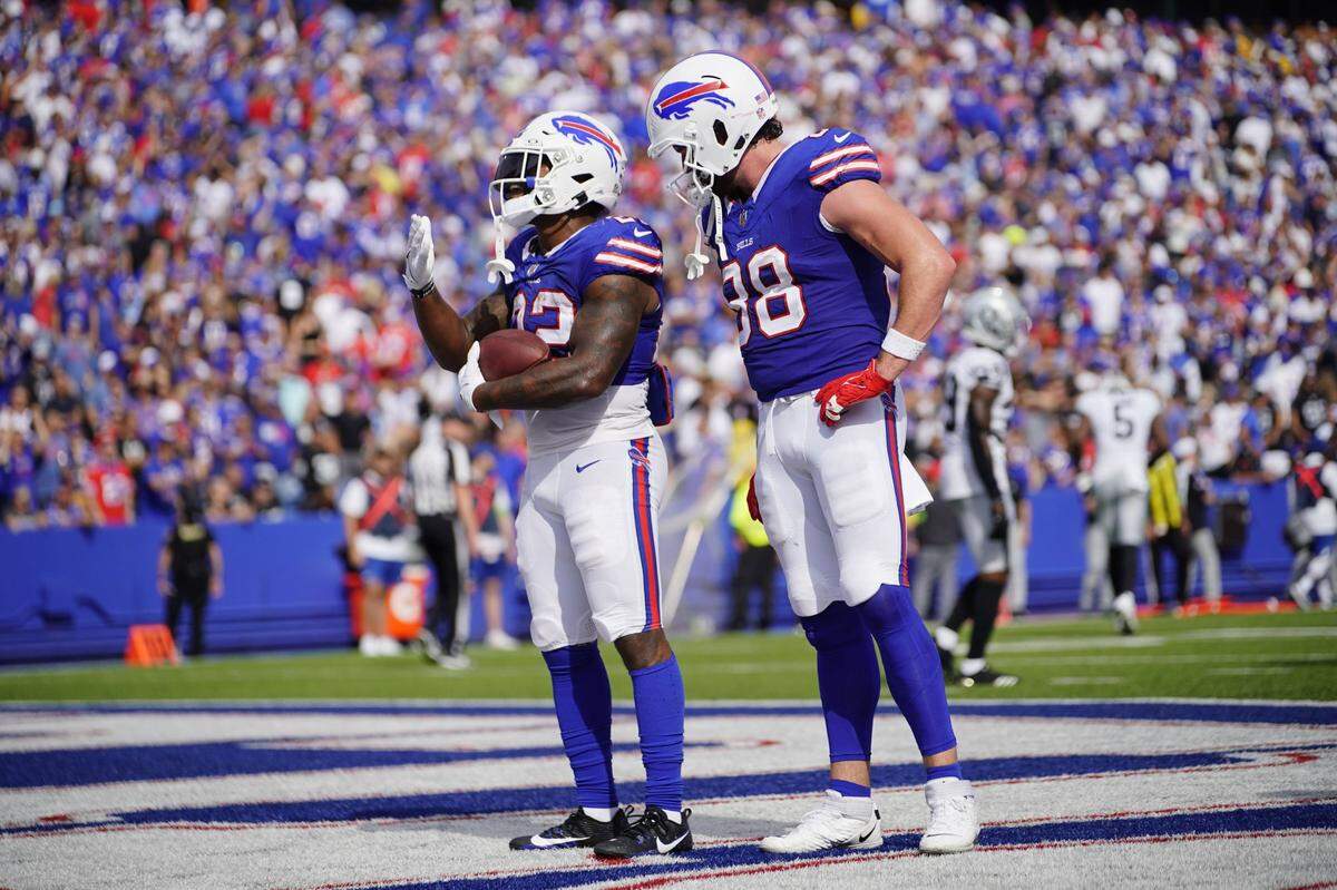 Damien Harris, left, and Dawson Knox celebrate his touchdown in the Bills’ game against the Raiders on Sept. 17, 2023.