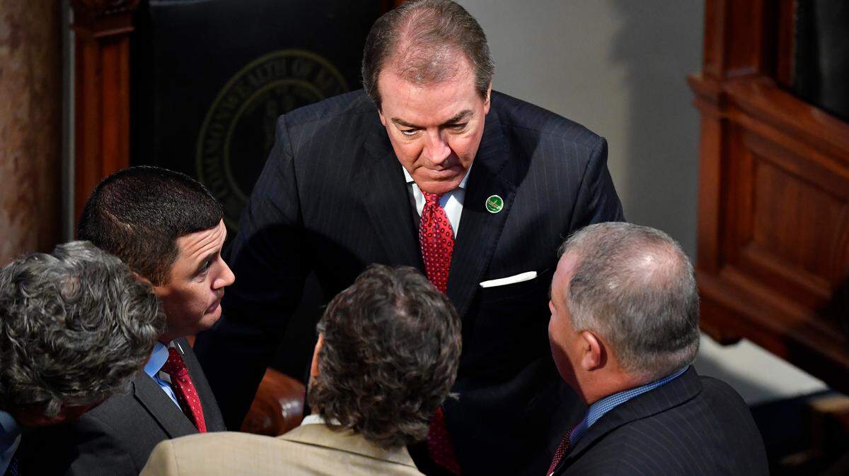 Kentucky Speaker of the House David Osborne, R-Prospect, center, talks with members of the House during a recess of a special session at the Kentucky State Capitol in Frankfort, Ky., Friday, July 19, 2019.