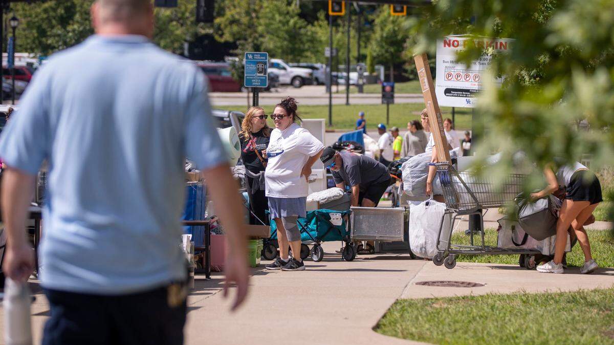 Students line up waiting to move their belongings in during Big Blue Move-In Tuesday, Aug. 20, 2024, at the University of Kentucky in Lexington, Kentucky. 