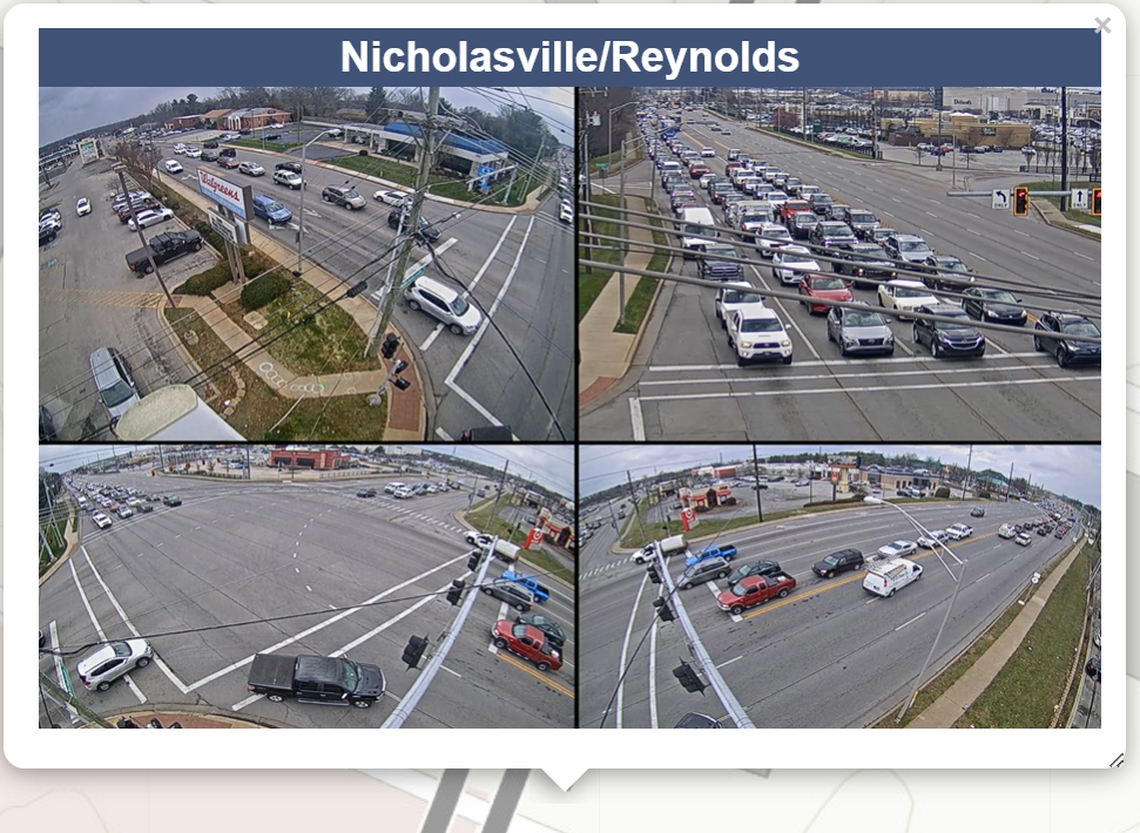 A traffic camera feed shows the busy intersection at Nicholasville and Reynolds Roads, taken Dec. 18, 2023. Traffic is backed up at a stop light as vehicles wait to proceed down the busy Nicholasville Road. 