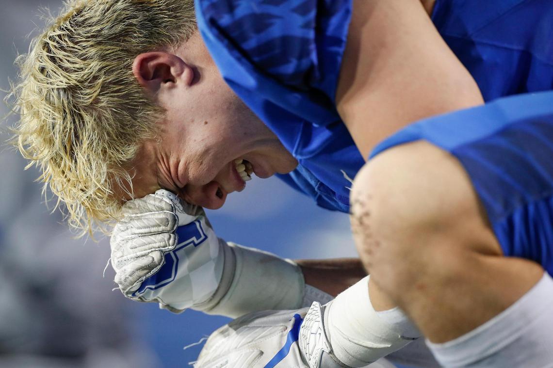 Lexington Christian’s Johnny Drake (11) is overcome with emotion late in the fourth quarter during the 2021 UK Orthopaedics Class 2A State Football Finals against Beechwood at Kroger Field in Lexington, Ky., Friday, Dec. 3, 2021. Beechwood beat Lexington Christian 23-21.